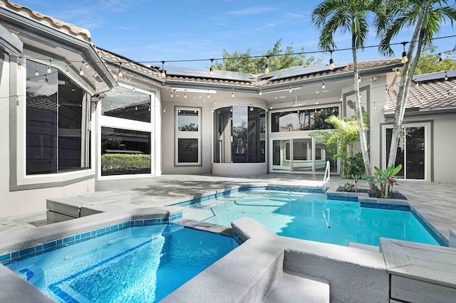 view of pool featuring a patio