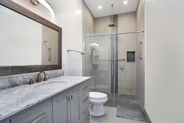6595 NW 32nd Ter, Boca Raton, FL 33496 - bathroom with toilet, vanity, a shower stall, and recessed lighting