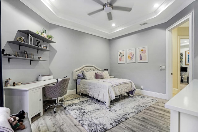 6595 NW 32nd Ter, Boca Raton, FL 33496 - bedroom with crown molding, a raised ceiling, light wood-style flooring, baseboards, and recessed lighting