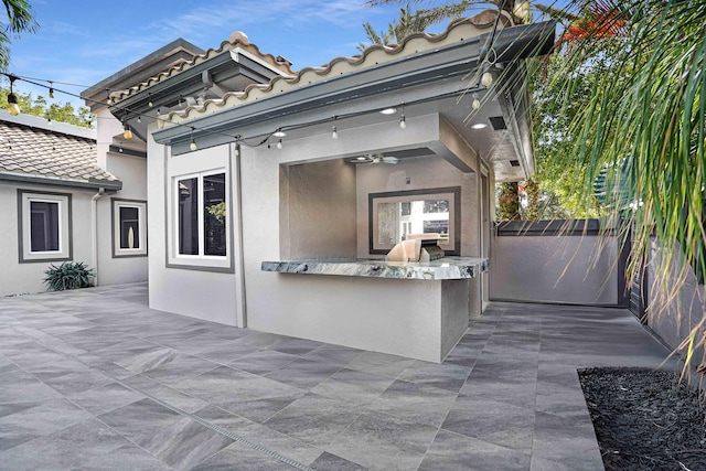6595 NW 32nd Ter, Boca Raton, FL 33496 - view of patio / terrace featuring exterior kitchen and a ceiling fan