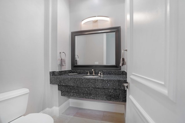 6595 NW 32nd Ter, Boca Raton, FL 33496 - half bathroom with a sink, toilet, and tile patterned floors