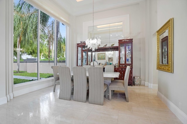 6595 NW 32nd Ter, Boca Raton, FL 33496 - dining space featuring a chandelier, a towering ceiling, baseboards, and ornamental molding