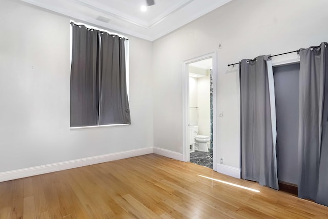 6595 NW 32nd Ter, Boca Raton, FL 33496 - unfurnished bedroom with wood finished floors, baseboards, ensuite bathroom, and ornamental molding