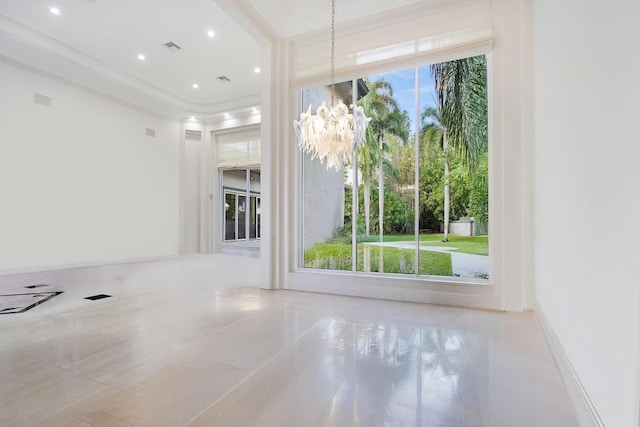 6595 NW 32nd Ter, Boca Raton, FL 33496 - unfurnished room with ornamental molding and a chandelier