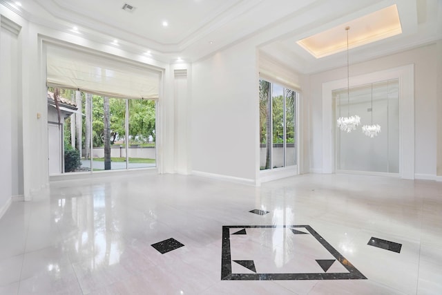 6595 NW 32nd Ter, Boca Raton, FL 33496 - empty room with a raised ceiling, a chandelier, crown molding, and baseboards