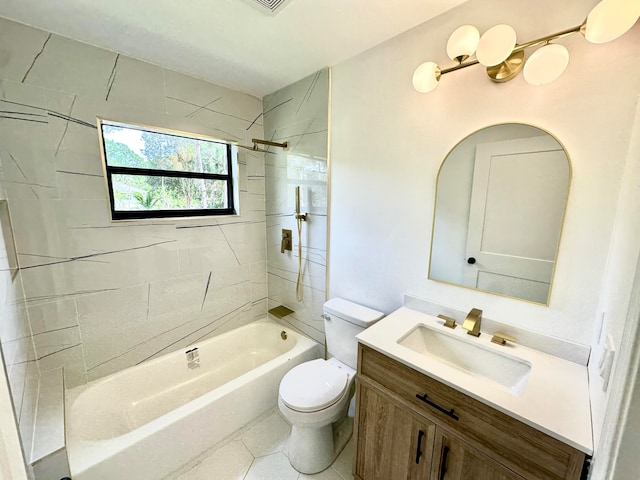 full bathroom with tile patterned flooring, vanity, tiled shower / bath combo, and toilet