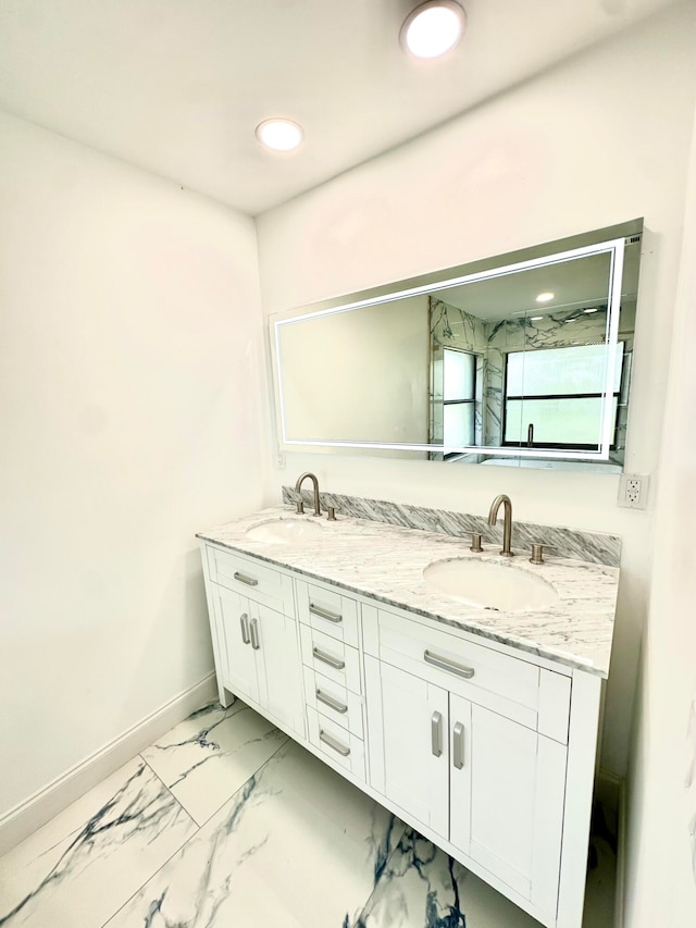 bathroom featuring vanity and a shower with door