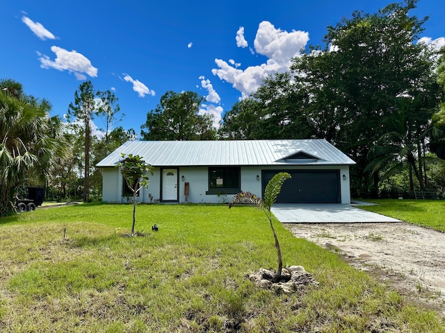 ranch-style home with a front lawn and a garage