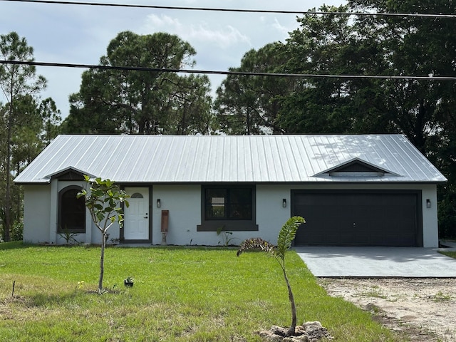 single story home with a front yard and a garage