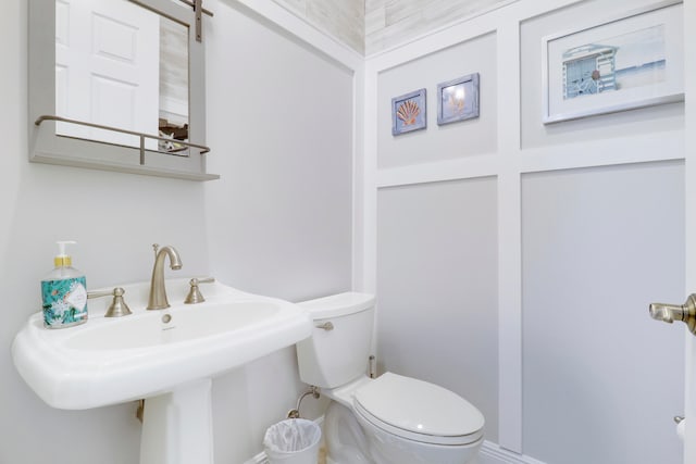 bathroom with toilet and sink