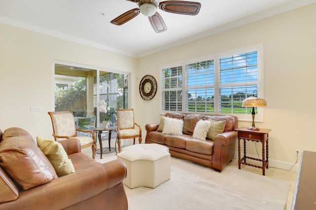 living room featuring crown molding, light carpet, and ceiling fan