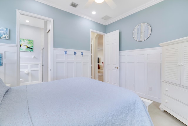 bedroom with crown molding, ceiling fan, and light colored carpet