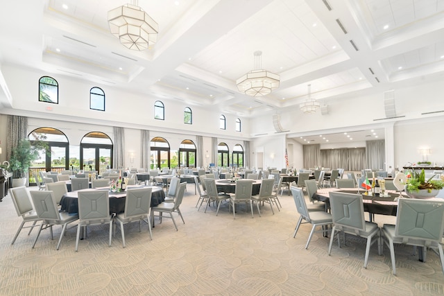 carpeted dining space featuring a high ceiling, beamed ceiling, and coffered ceiling