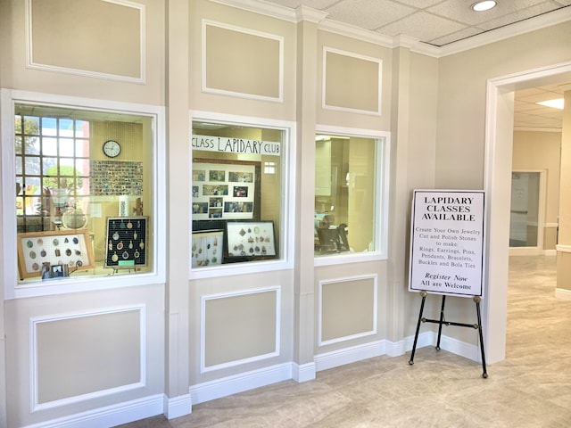 doorway to outside featuring a paneled ceiling