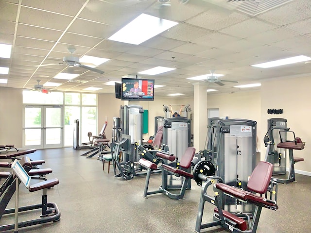 workout area featuring a drop ceiling and ceiling fan