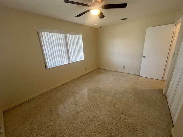 unfurnished room with ceiling fan