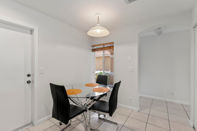 dining space with light tile patterned floors