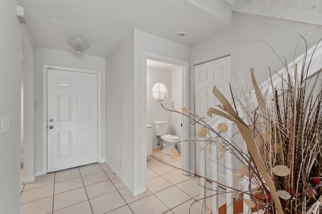 entrance foyer with light tile patterned floors