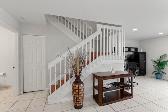 stairway with tile patterned flooring