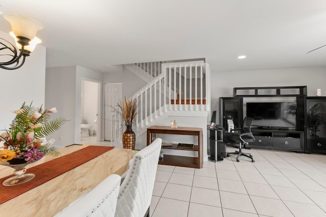 interior space featuring ensuite bath and a notable chandelier