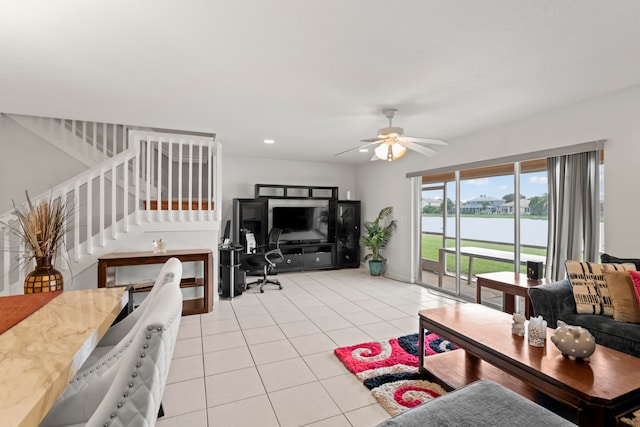 tiled living room with ceiling fan