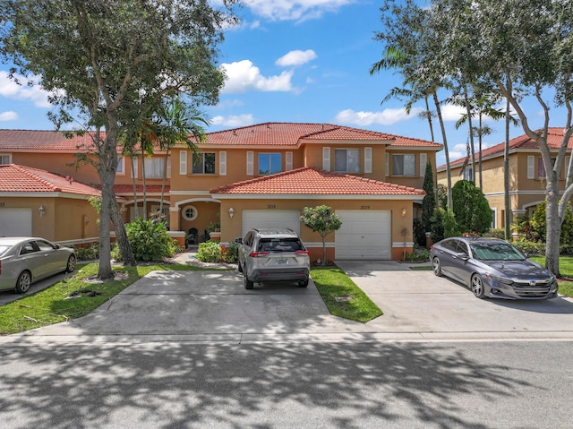 mediterranean / spanish-style home with a garage