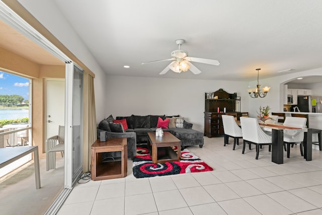 tiled living room featuring ceiling fan