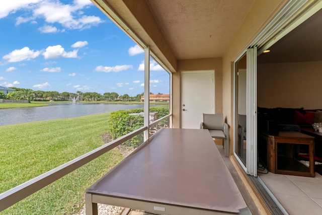 balcony featuring a water view