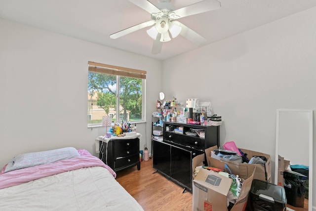 bedroom featuring light hardwood / wood-style flooring and ceiling fan