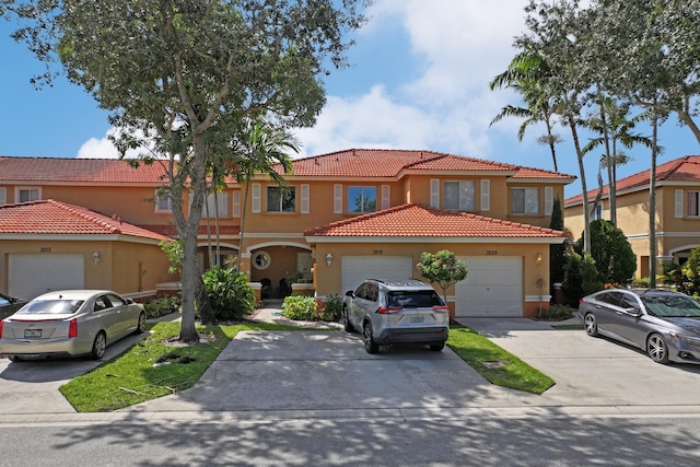 mediterranean / spanish house featuring a garage