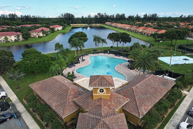 view of swimming pool with a water view