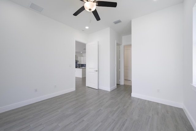 interior space featuring ceiling fan and light wood-type flooring