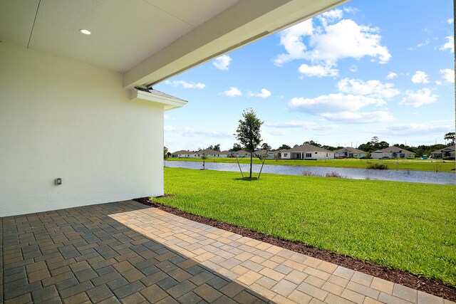 view of patio / terrace featuring a water view