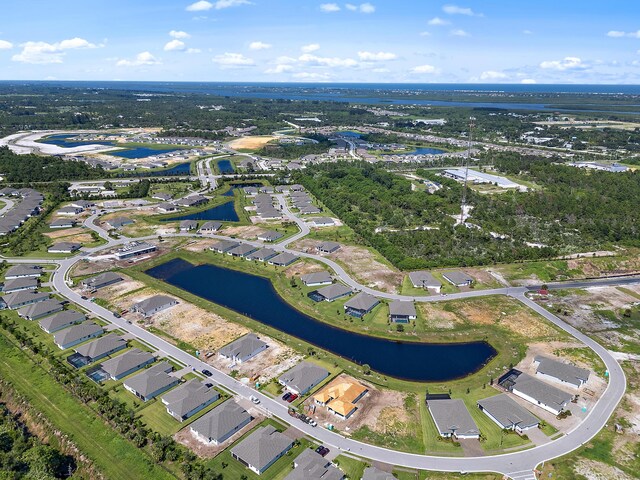 drone / aerial view with a water view