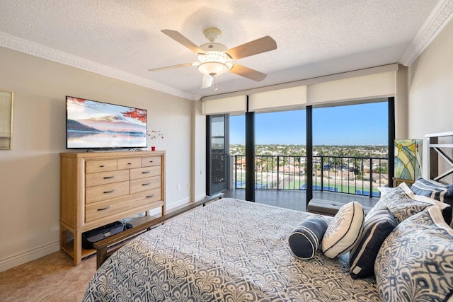 bedroom featuring ceiling fan, a textured ceiling, crown molding, and access to exterior