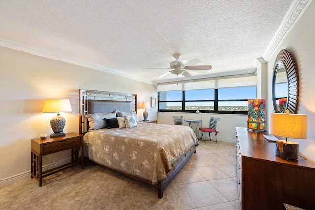 tiled bedroom with a textured ceiling, ceiling fan, and crown molding