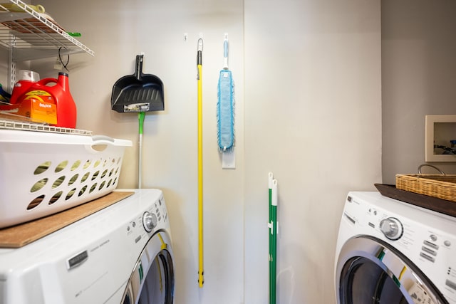 clothes washing area with independent washer and dryer