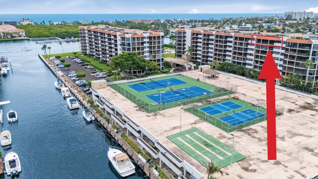 birds eye view of property with a water view