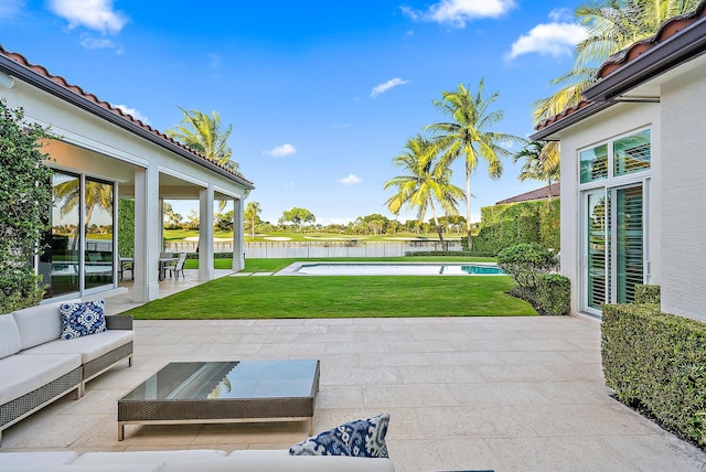 view of patio featuring outdoor lounge area and a fenced in pool