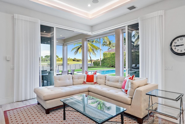 living room with hardwood / wood-style floors and a wealth of natural light