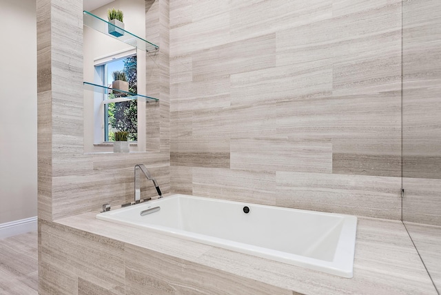 bathroom with tiled tub