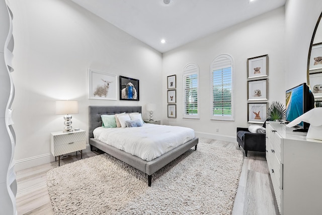 bedroom with light hardwood / wood-style floors