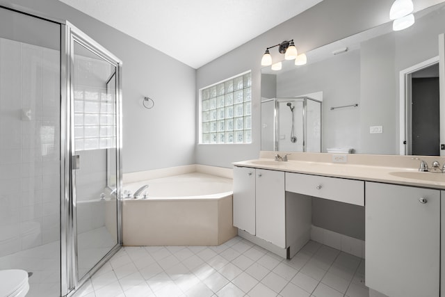 full bathroom with vanity, toilet, independent shower and bath, tile patterned floors, and vaulted ceiling