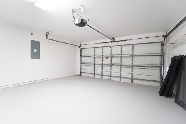 garage with a garage door opener and electric panel