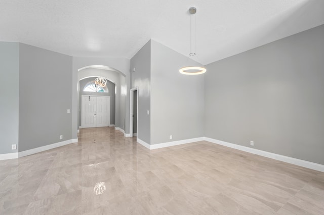 unfurnished room featuring a textured ceiling