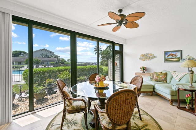 sunroom / solarium with ceiling fan