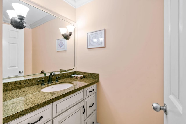 bathroom featuring crown molding and vanity