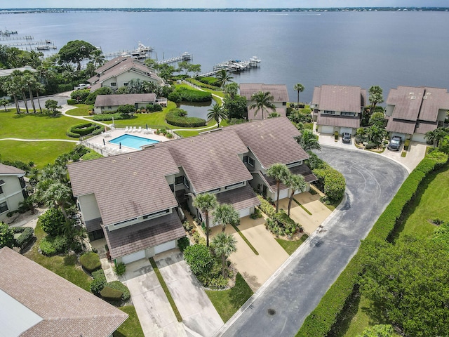 birds eye view of property with a water view