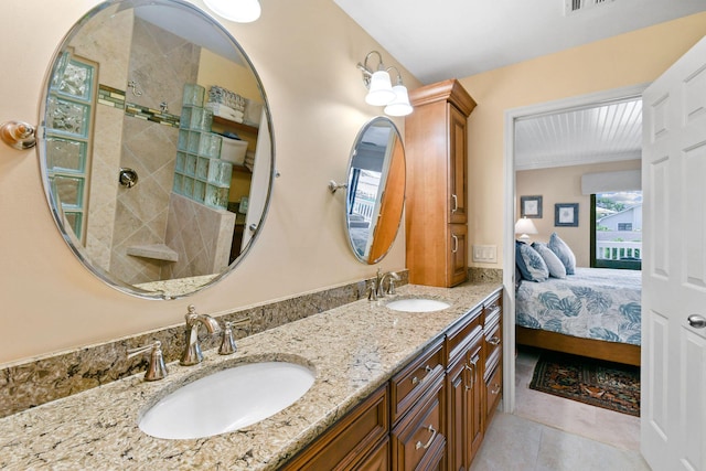 bathroom featuring tile patterned flooring and vanity