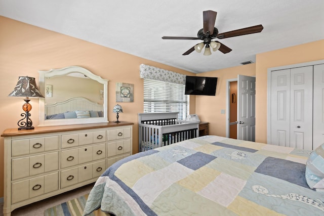 bedroom with ceiling fan and a closet